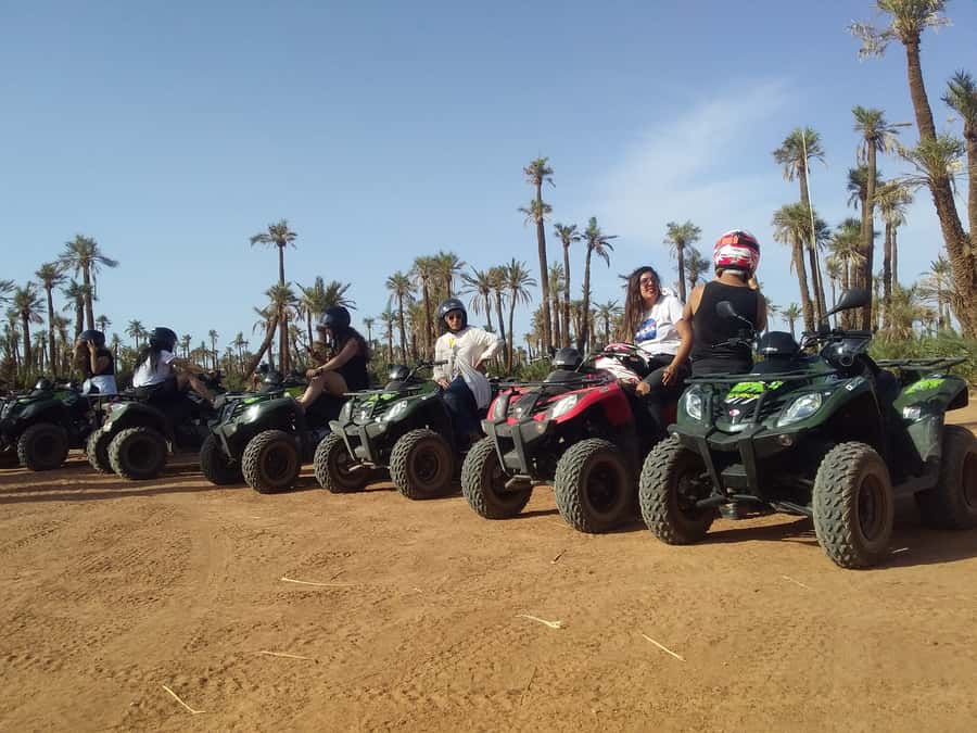 Marrakech, explore the palm grove desert by quad bike - Sunset photo time and the oasis return through palm trees