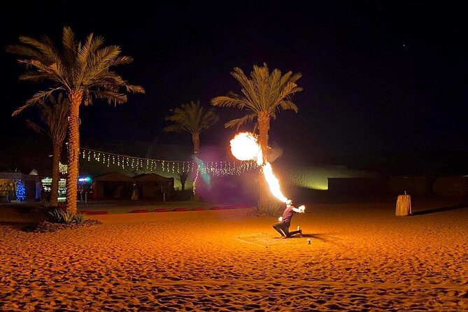 One hour Quad Bike at Red Sand Desert Safari with Camel Ride and BBQ Dinner - Shows Over Dinner: Belly Dance, Fire, and Tanura