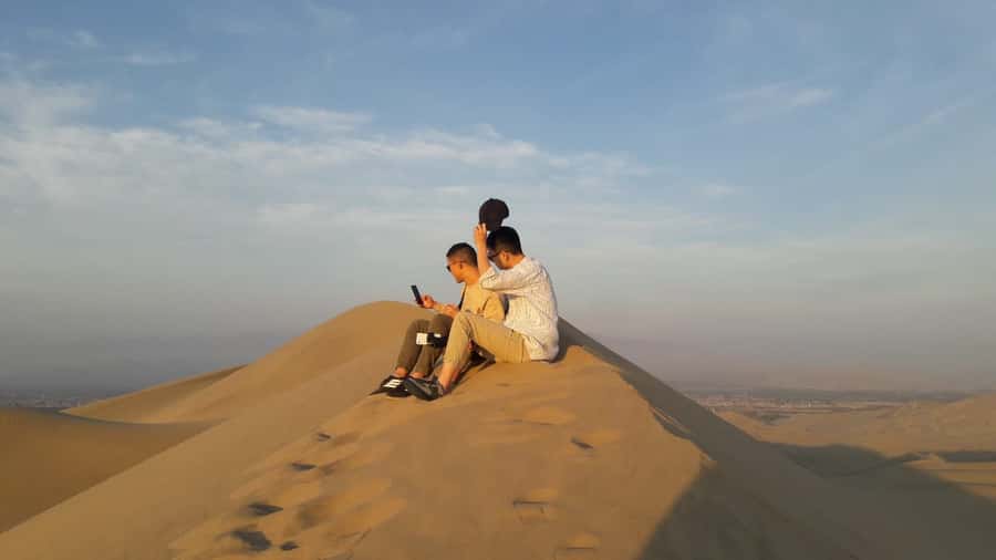 Paracas or Pisco: Private Huacachina Oasis Tour & Buggy Ride - Huacachina Oasis Stroll: Palm Trees, Lagoon Views, and Photo Angles