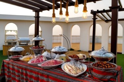 Premium Desert Safari Dubai with BBQ and ATV - Sandboarding and the camel ride: two kinds of desert fun