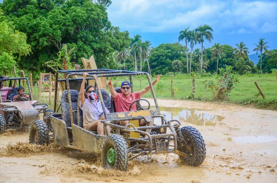 Punta Cana: Countryside and Macao Beach Half-Day Buggy Tour - Macao Beach time: sand, waves, and limestone cliff views