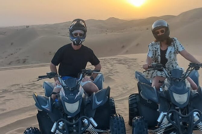 Quad biking with pick and drop - Al Faqaa Masjid stop: desert scenery and camels in the mix