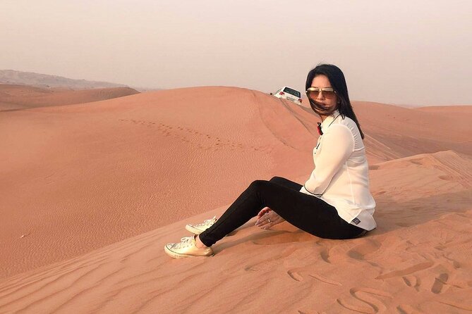 Red Dune Desert Safari with Dinner Quad Bike and Camel Ride - Sunset Photo Stops and Sandboarding Slides