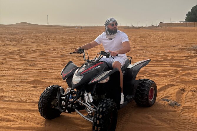 Sunrise Desert safari With Quad bike ride Sandboard & Camel ride - Sandboarding: The Fun Piece Between Speed and Stillness